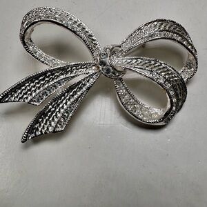 Vintage Roman silver tone clear rhinestone bow brooch